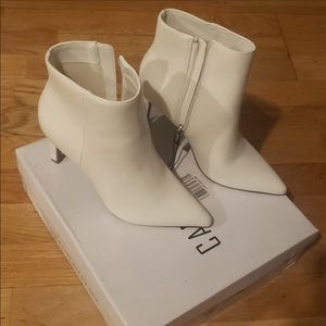 They do have a tiny mark on the right boot